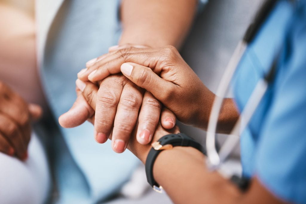 Empathy, trust and nurse holding hands with patient for help, consulting support and healthcare advice.